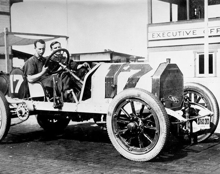 Early Indianapolis 500 race car with thin tires