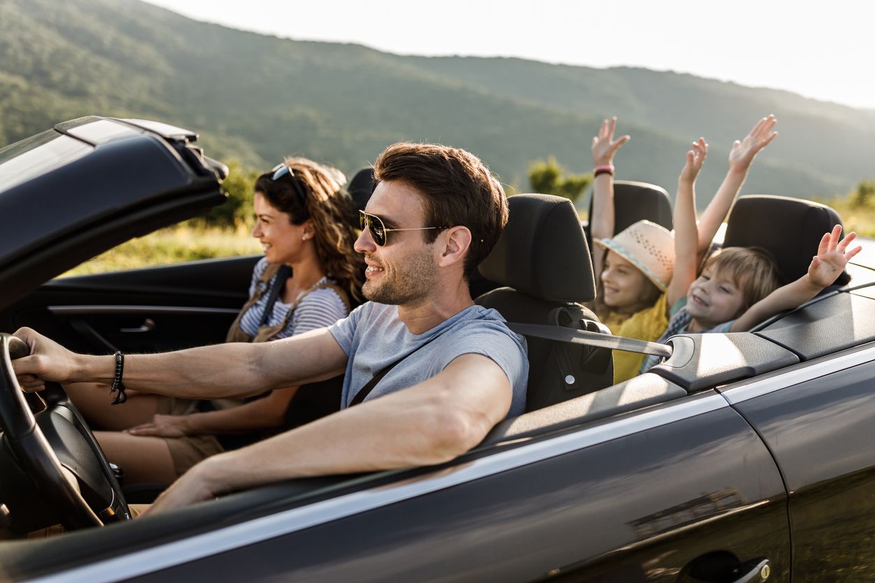 image of a family having fun on a road trip