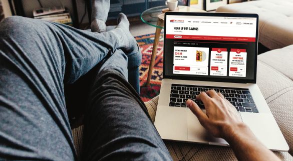 picture of man relaxing on a couch using a laptop