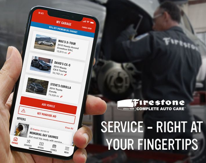 Person holding phone with the Firestone Complete Auto Care mobile app
