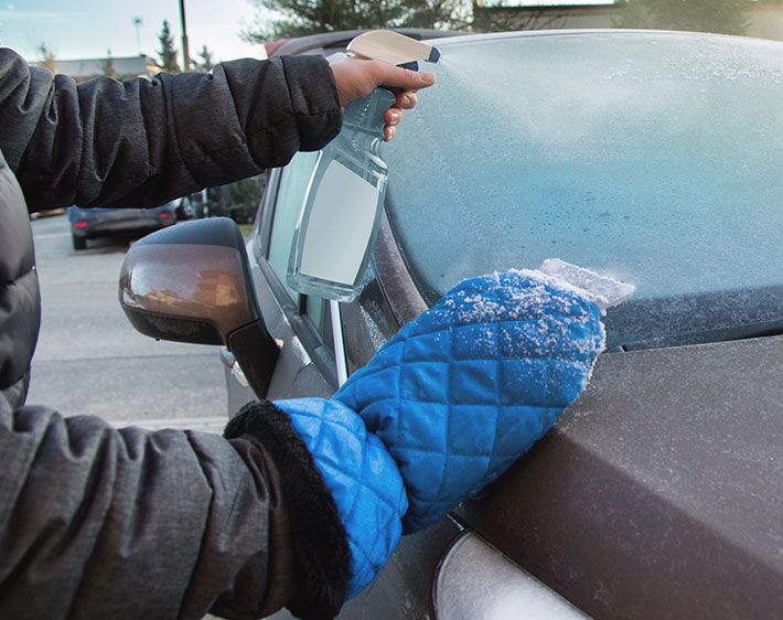 Hand spraying solution to defrost windshield wipers