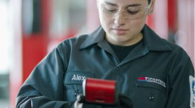 A technician performing a battery check. 