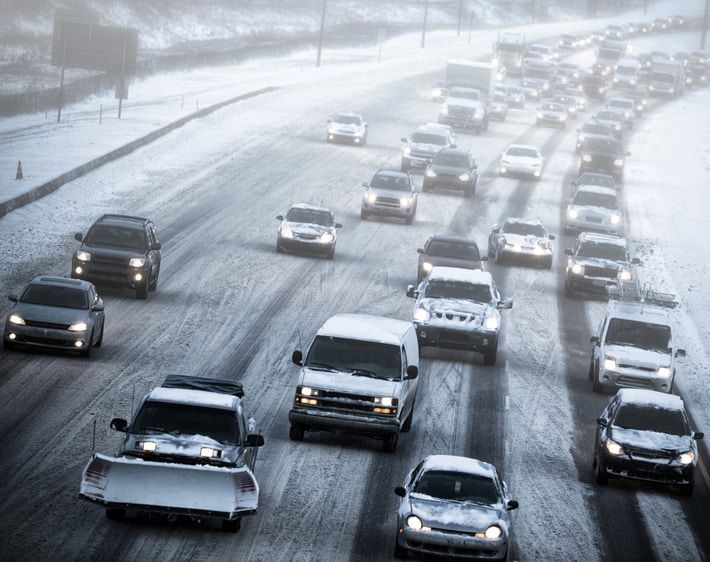 Heavy highway traffic in a snowstorm