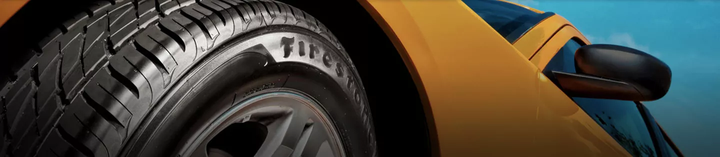 Close up of firestone tire on car