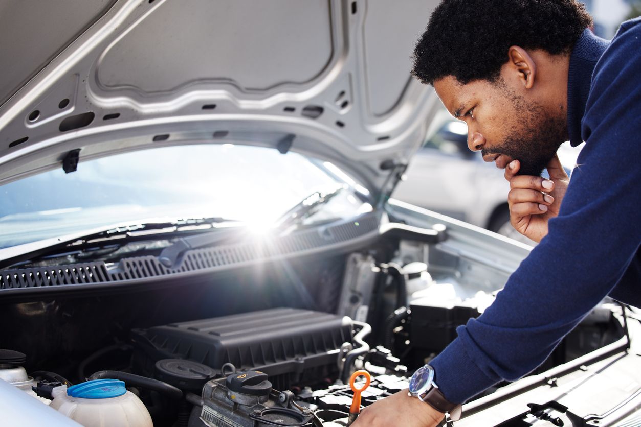 Mechanic checking engine