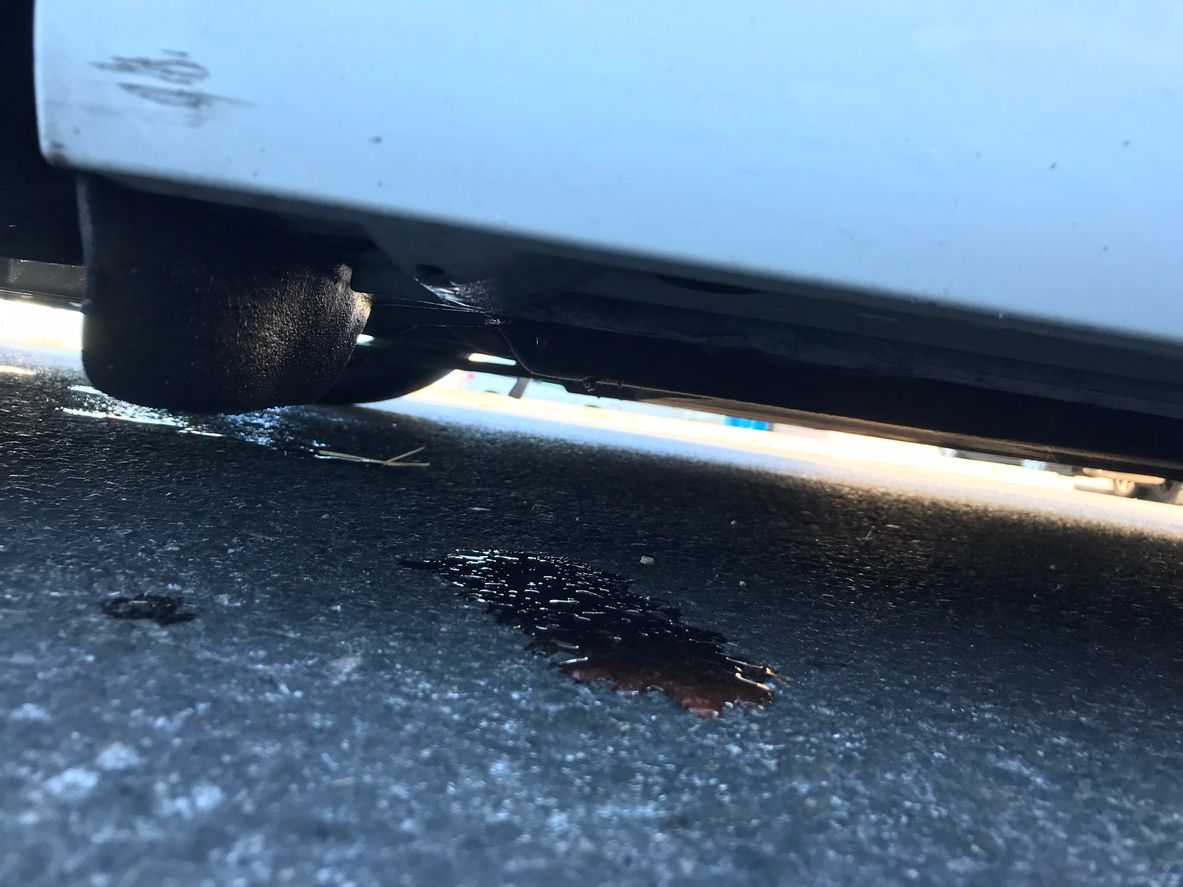 Oil leak dripping from engine