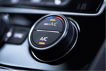 Lit up control dial for a car air conditioning system.