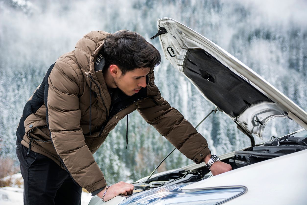 image of a man looking at his battery