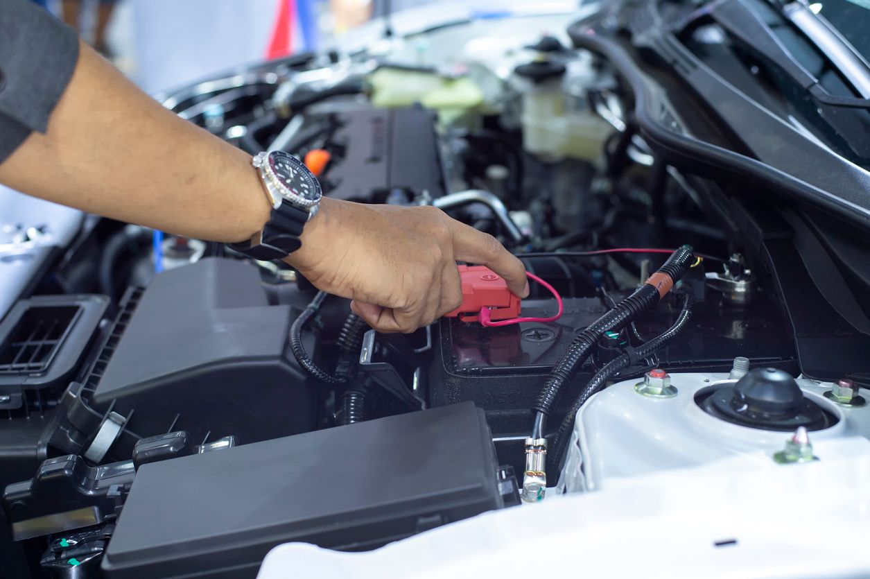 image of mechanic working on battery