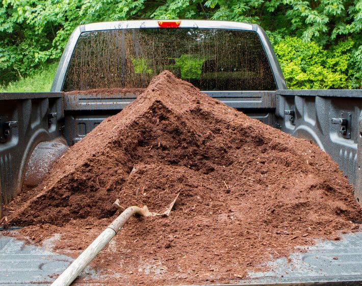 mulch in the bed of a truck