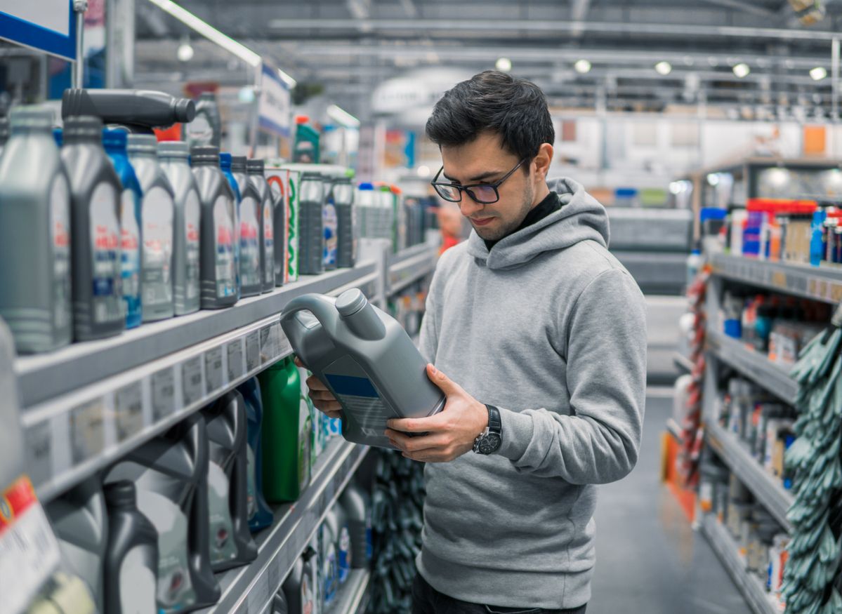 Image of man choosing oil