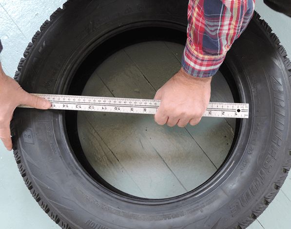 Measuring center of old tire for holiday tire project