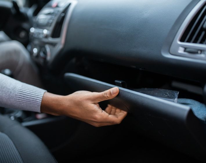 Person opening a glove compartment