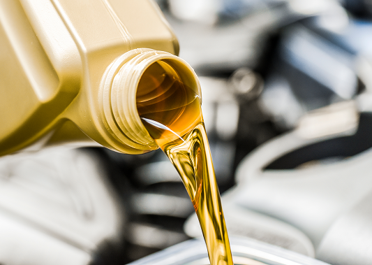 Motor oil being poured out of a container.