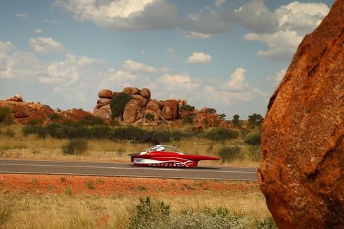 Red solar car in the desert