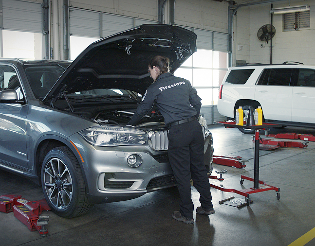 A technician changing oil