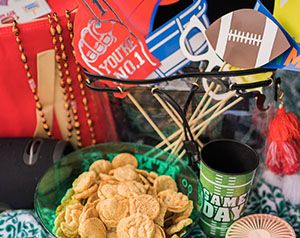 Table of football party snacks and decorations