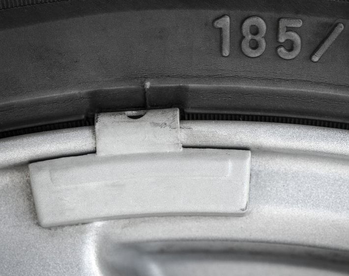 Close-up of tire balancing