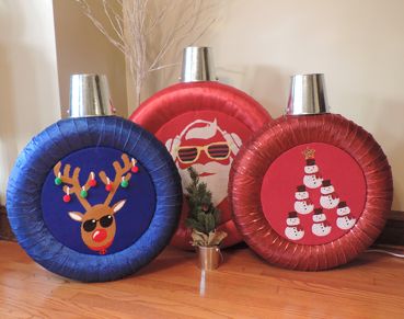 Final tire craft, transforming old tires into giant holiday ornaments, displayed in foyer of home