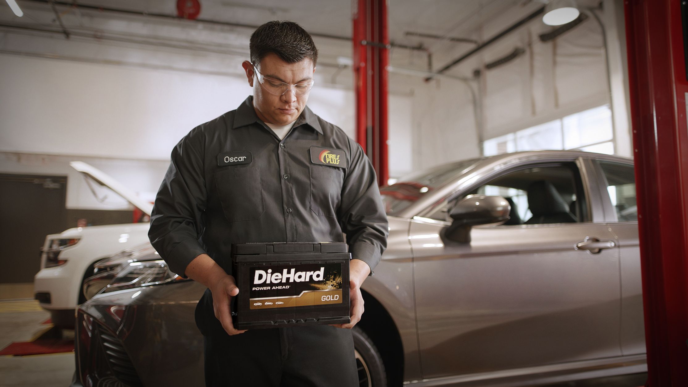 Man Holding Car Battery