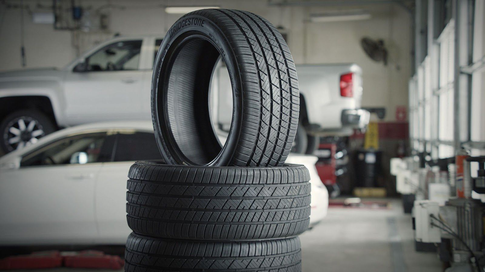 image of tires stacked on top of each otehr