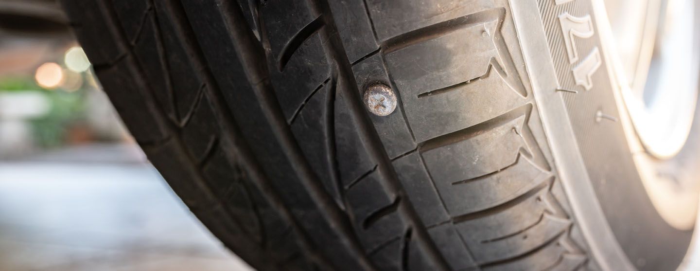 Tire with a nail in it