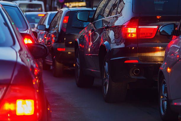 image of a series of cars with their brakes lights on