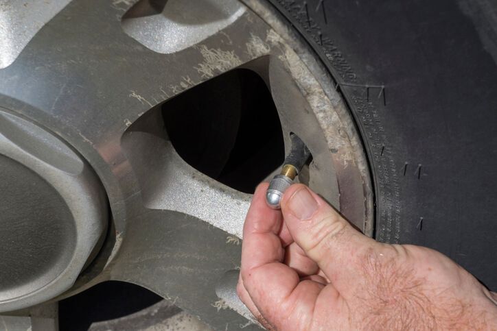 twisting air valve stem cap on tire