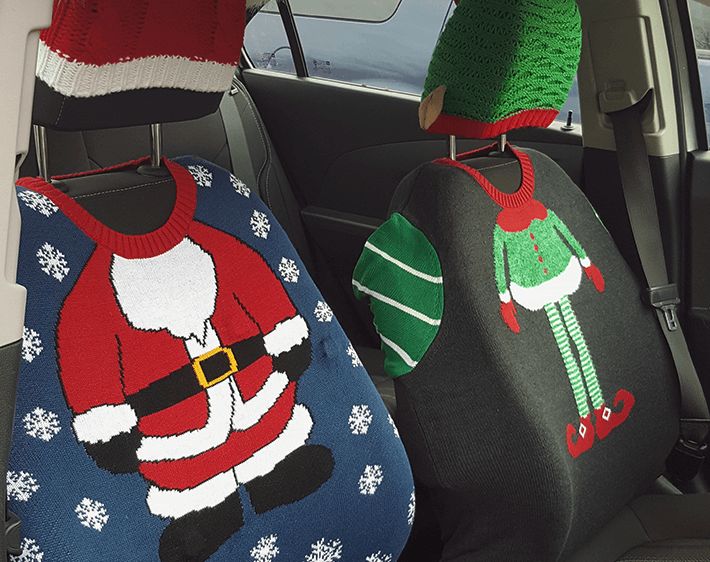 Car seats covered by festive ugly sweaters