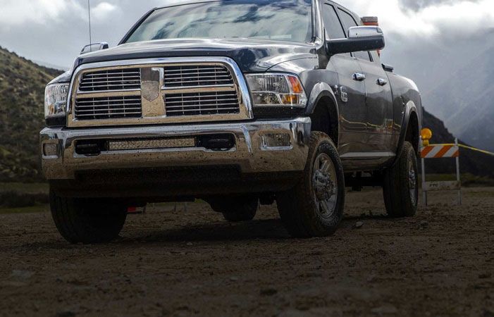 A pickup truck driving down the road.