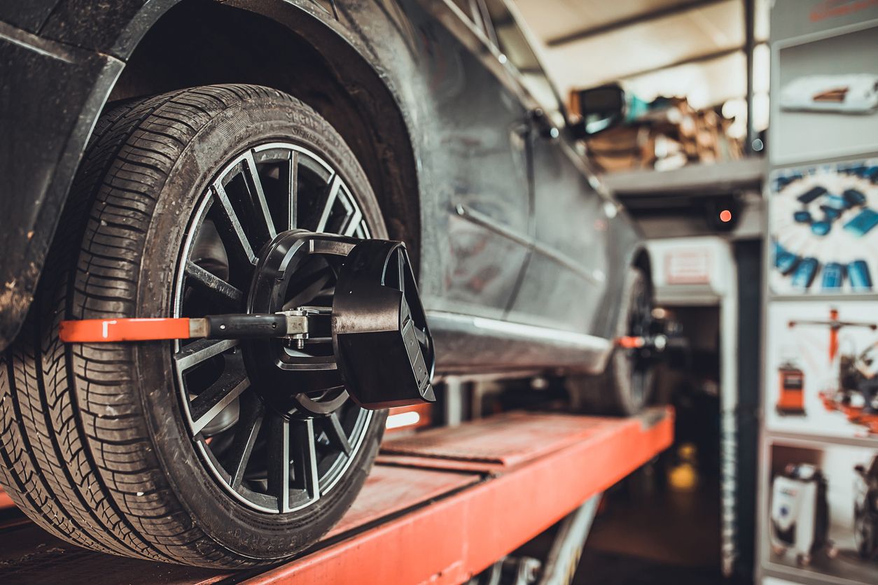 image of wheel alignment equipment on a car