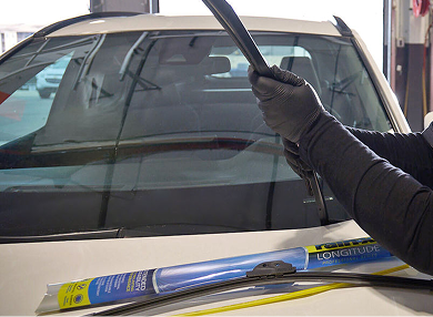 Wiper blades displayed on the car.