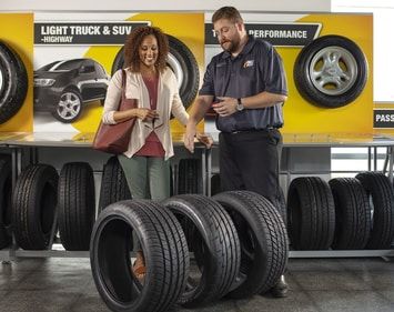 woman shopping for tires with help from tires plus teammate