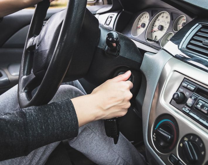 image of driver starting a car