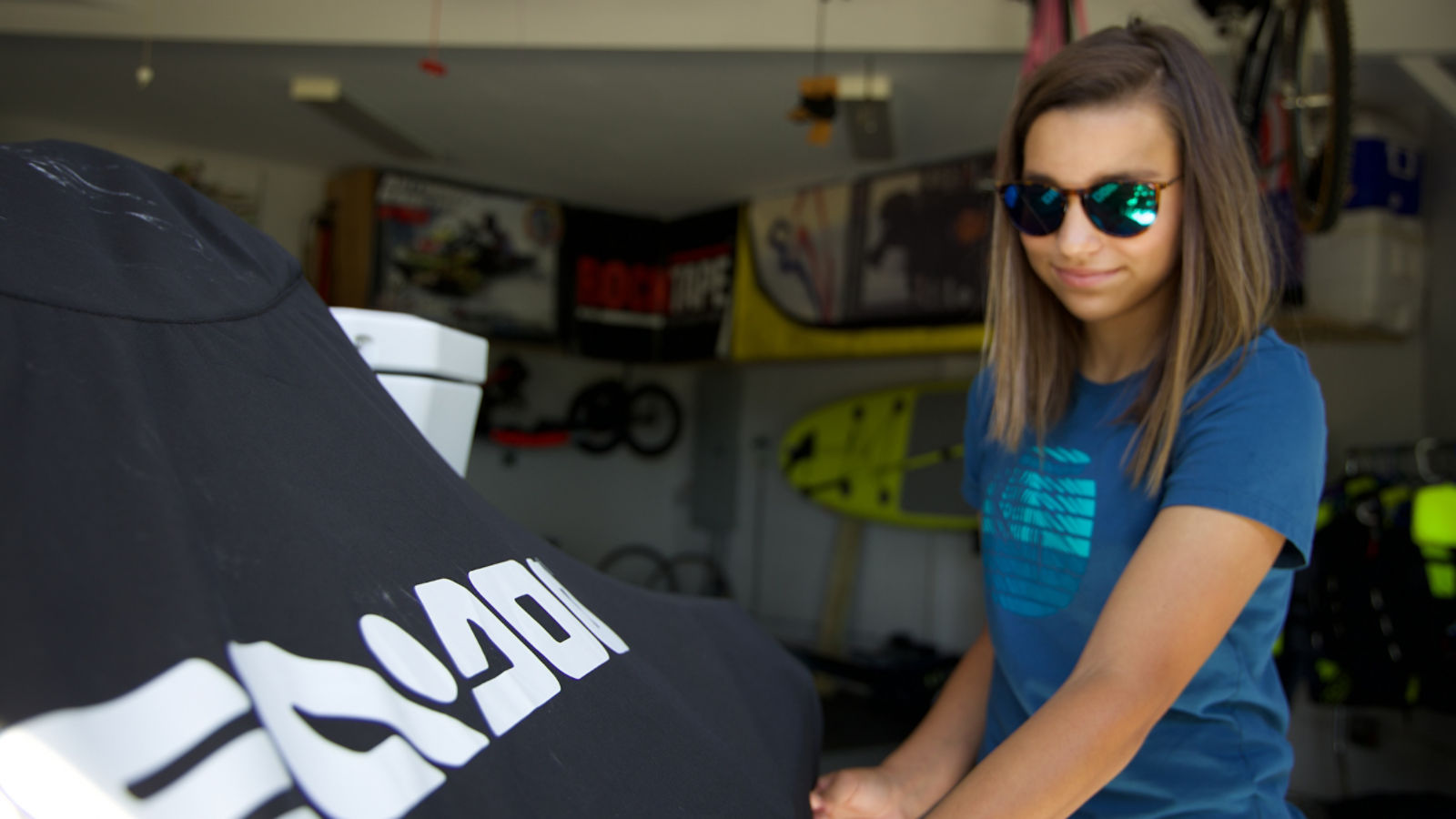 Girl putting a cover on her Sea-Doo
