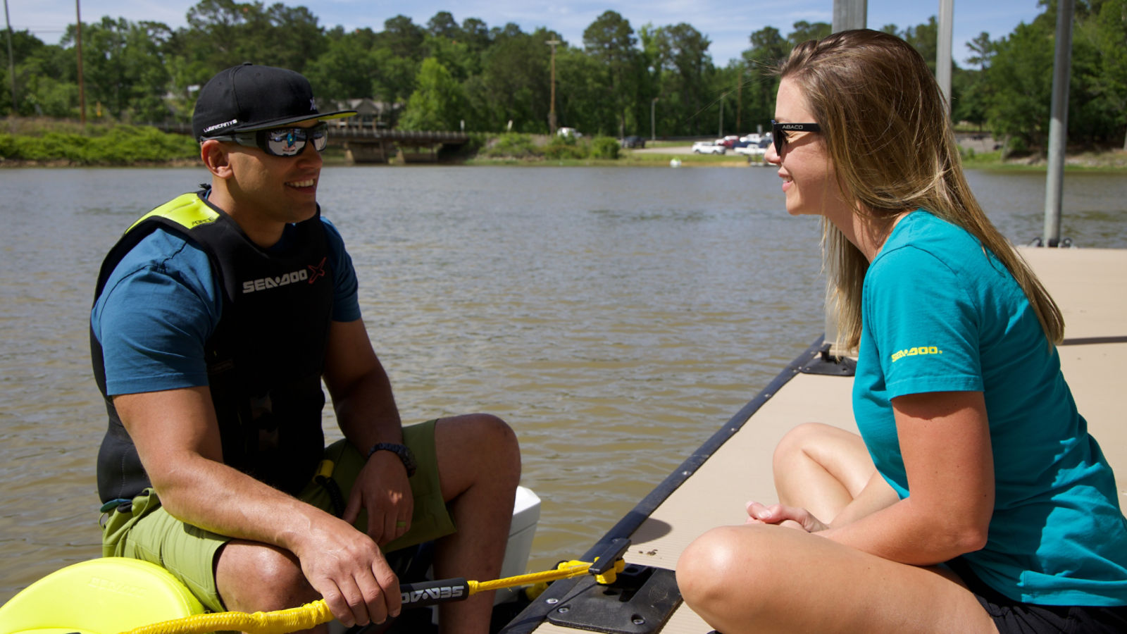 Two people showing how to dock a Sea-Doo personal watercraft