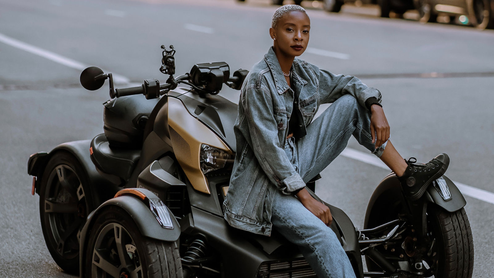 A rider and her Can-Am On-Road vehicle