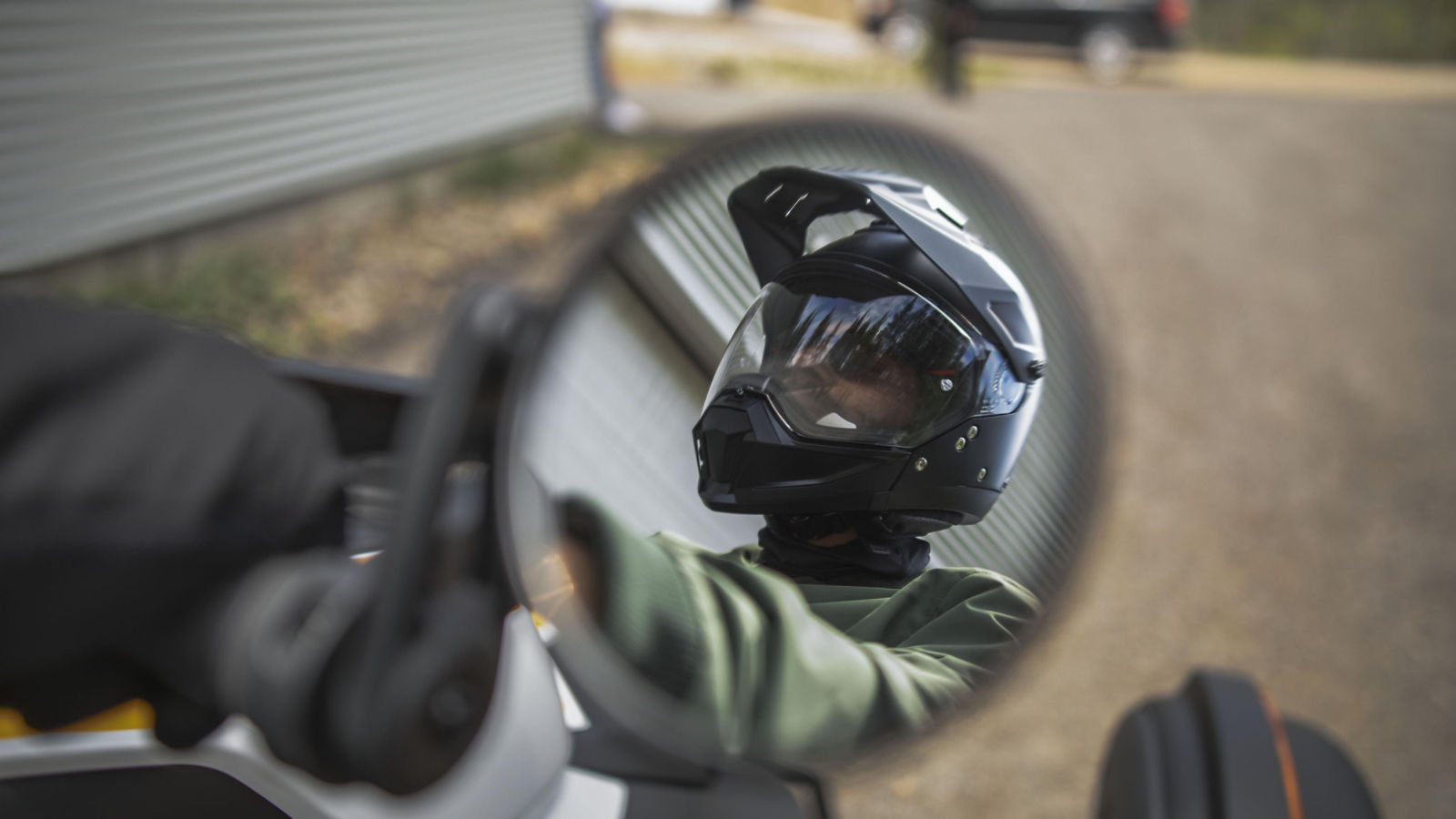 A driver with his his helmet, ready for a ride on his Can-Am