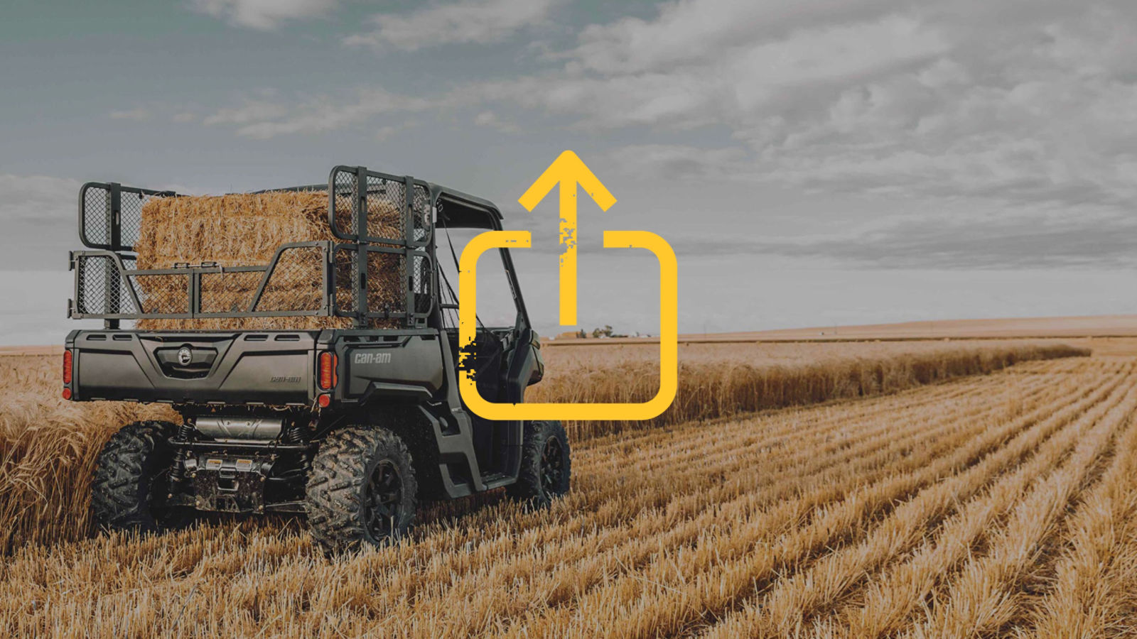 A woman with a Can-Am SxS next to her