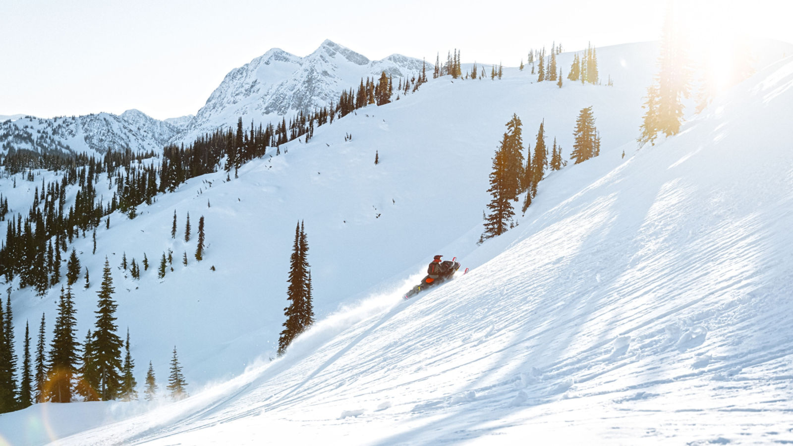 Man snowmobiling in Backcountry