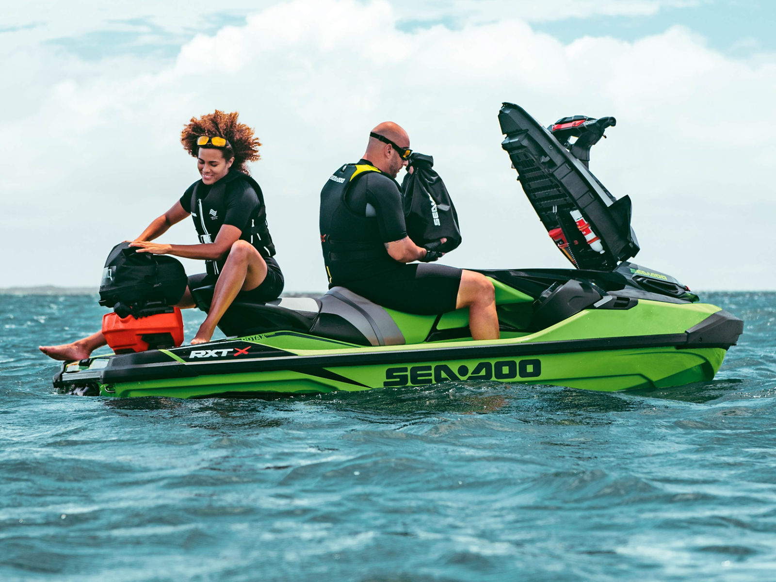 Sea-doo RXT with two people on top relaxing on the ocean