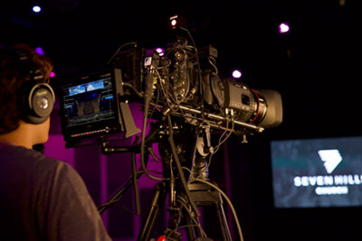 Man filming at a church with a cinema camera