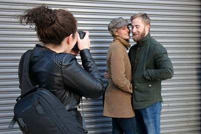 Candid shot of Lindsay photographing her clients