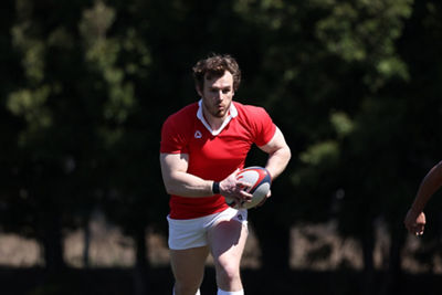 Rugby player running toward camera