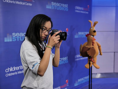 Intern Using Canon Camera to Take a Picture