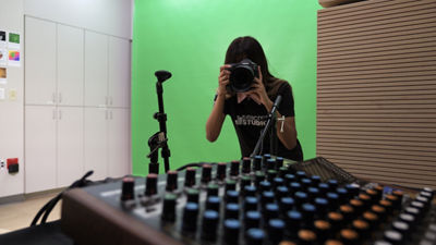 Intern Using Canon Camera to Take a Picture