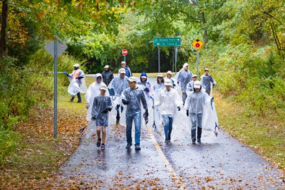Canon employees cleaning Bethpage State Park during the 27th Annual Clean Earth Crew event