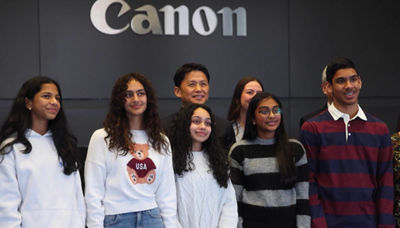 Group photo showing Candlewood Middle School students with Canon USA's President & CEO Sammy Kobayashi