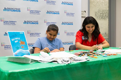 Children and hospital staff doing crafts