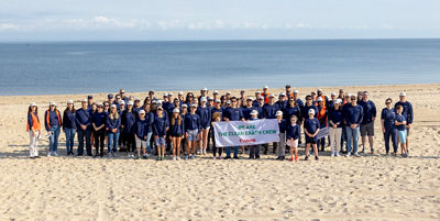 Employees and their families at Canon's Clean Earth Crew Supports Cleanup